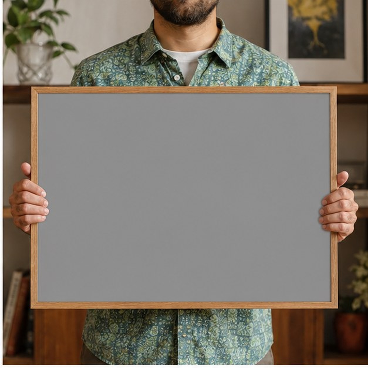 Collector holding a framed artwork
