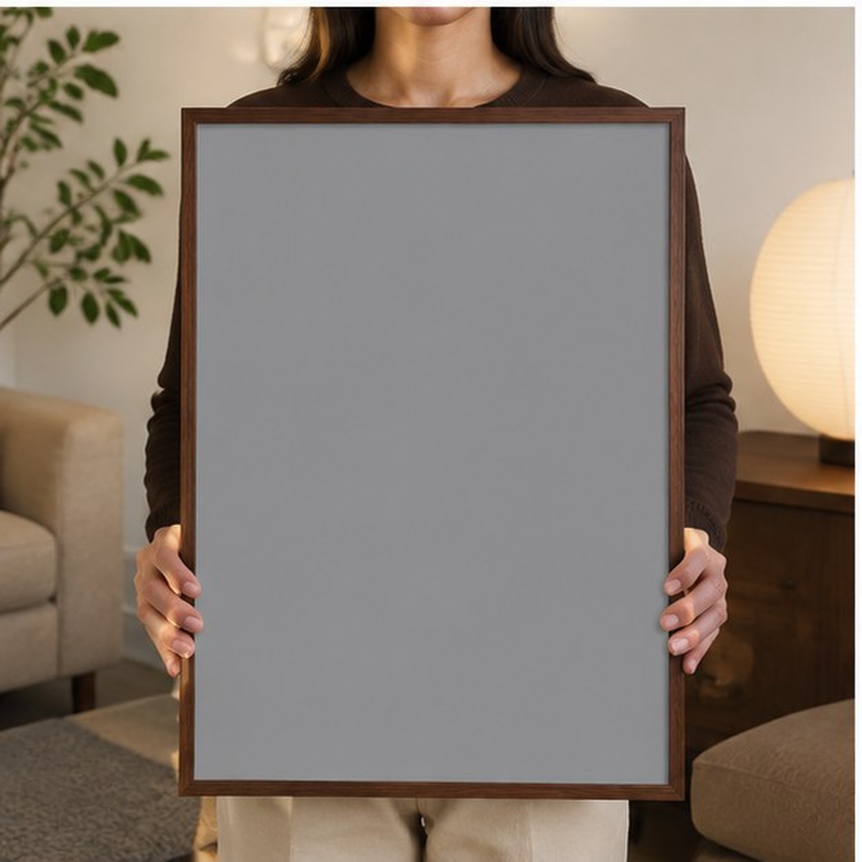 Collector holding a framed artwork