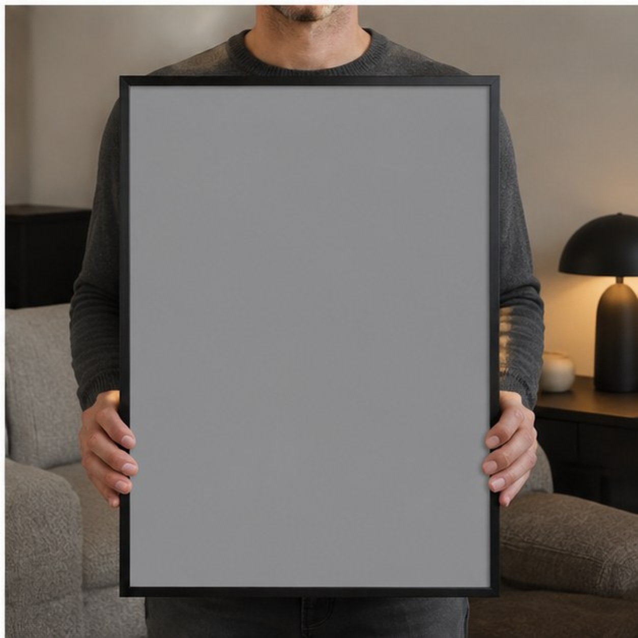 Collector holding a framed artwork