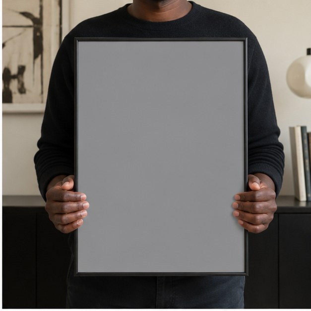 Collector holding a framed artwork