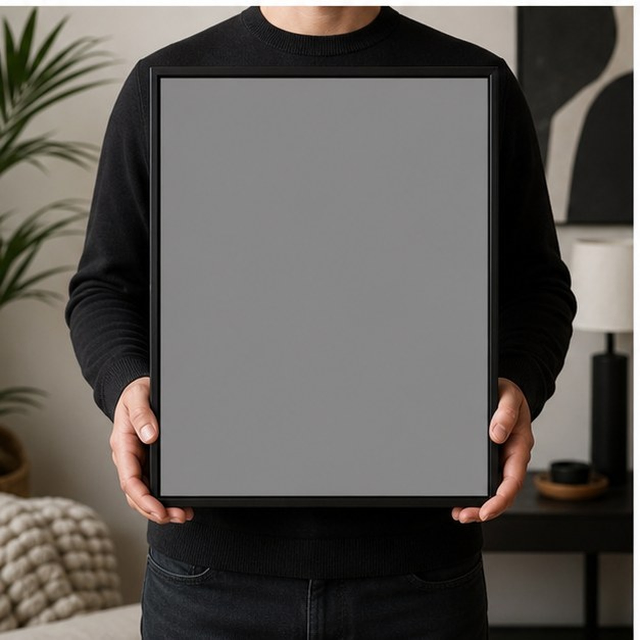 Collector holding a framed artwork